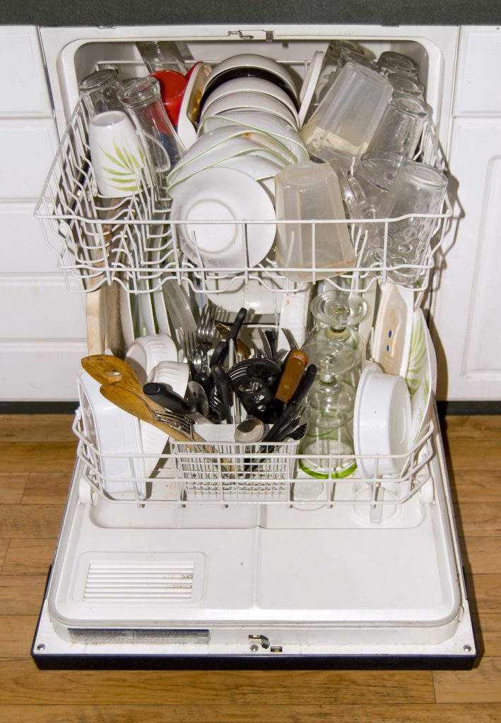 A full dishwasher - ready to go. It is all loaded up with dirty dishes.